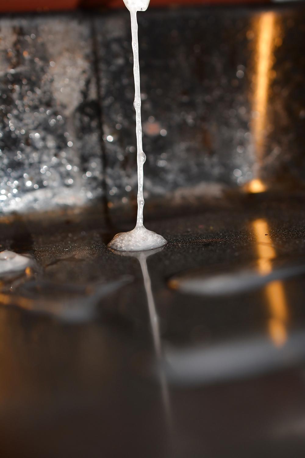 17P Precum and Cum dripping out of condoms (closeup)