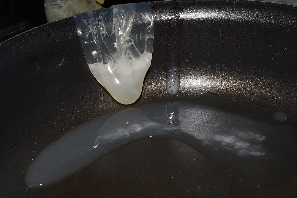 17P Precum and Cum dripping out of condoms (closeup)