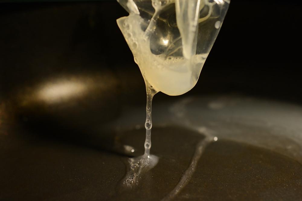 17P Precum and Cum dripping out of condoms (closeup)
