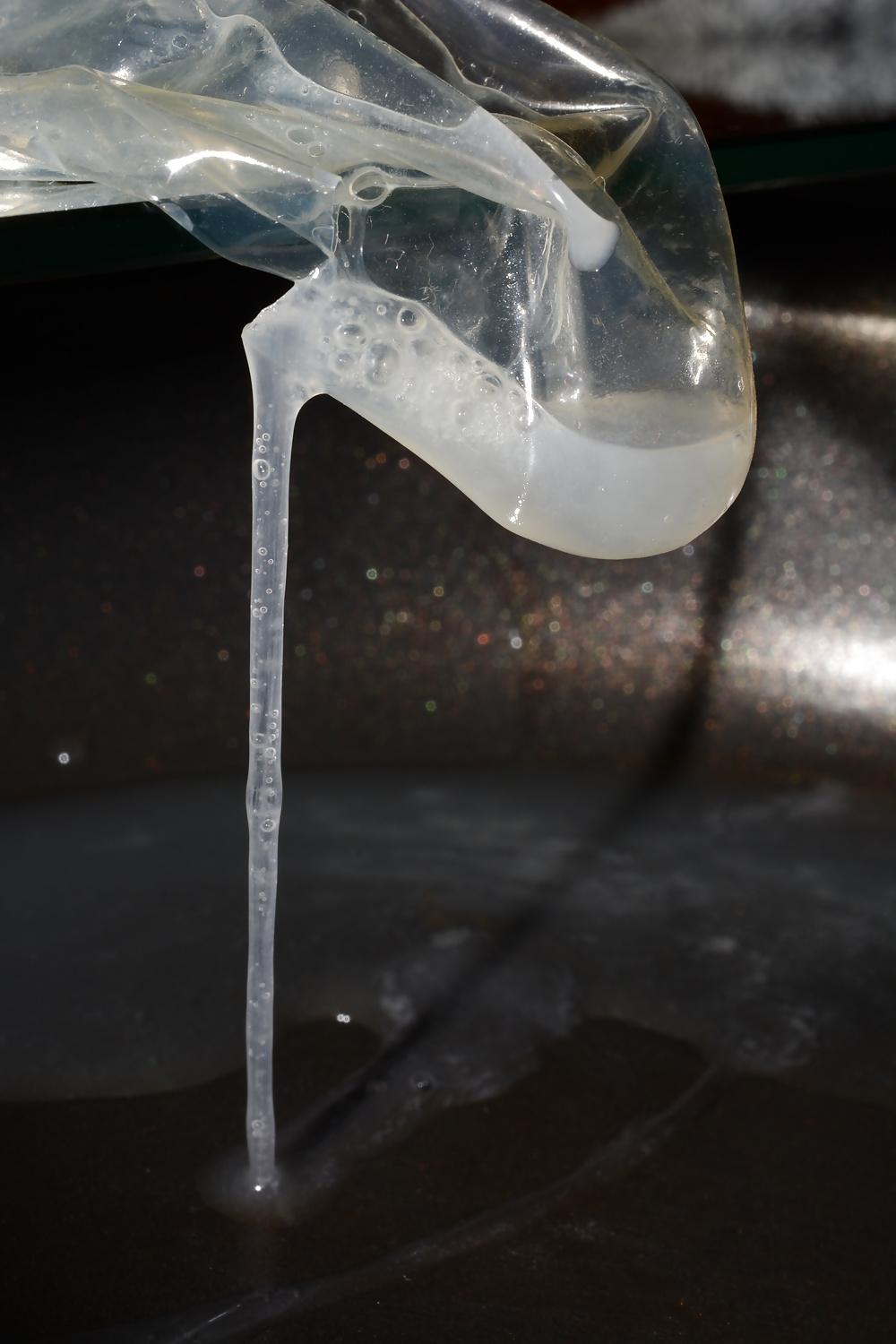 17P Precum and Cum dripping out of condoms (closeup)