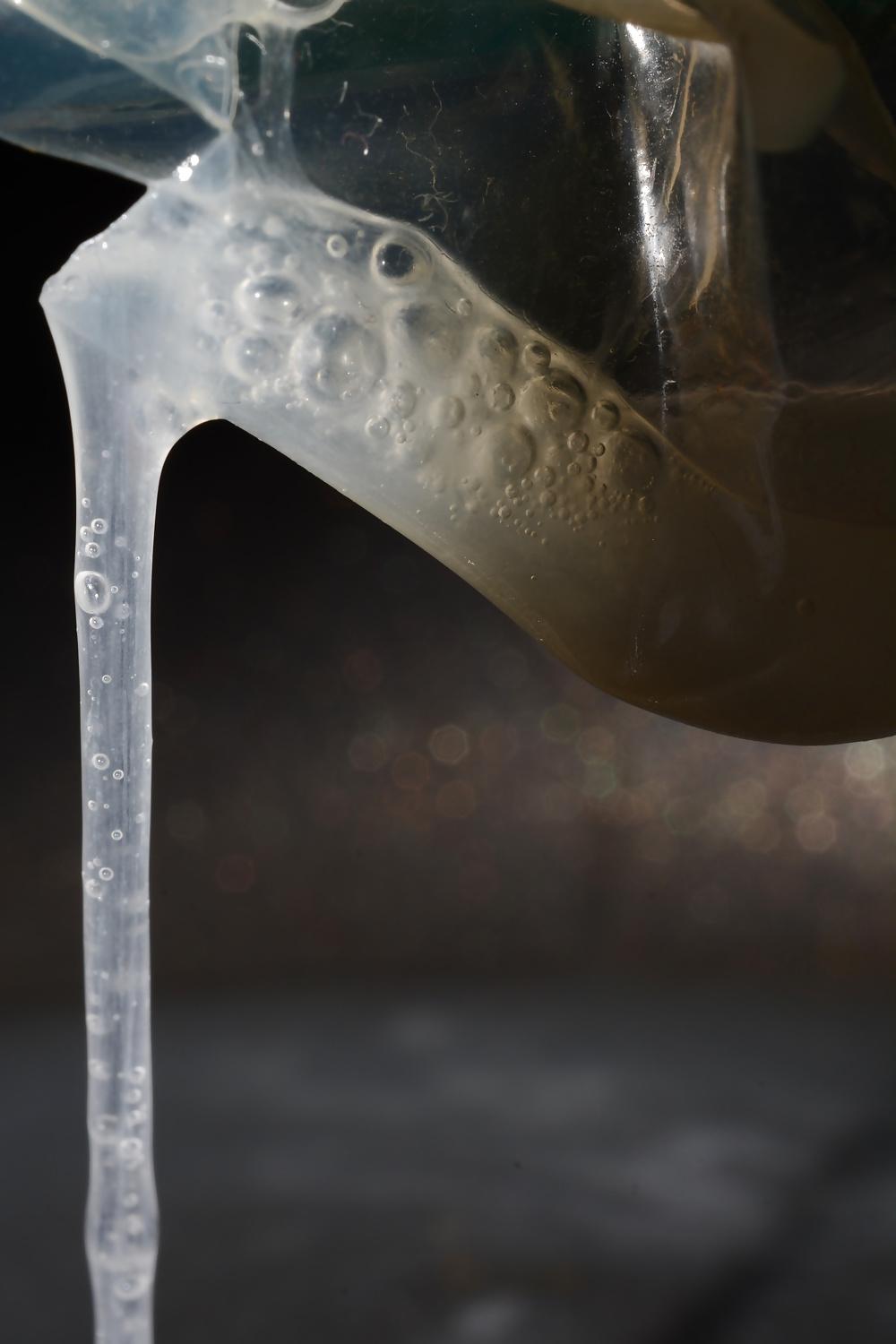 17P Precum and Cum dripping out of condoms (closeup)