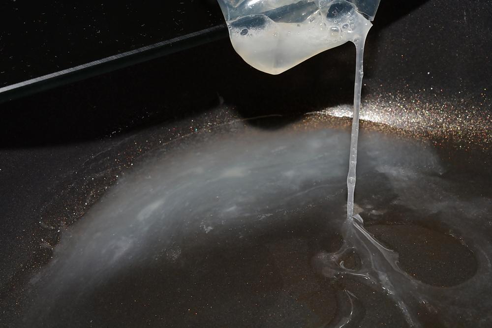 17P Precum and Cum dripping out of condoms (closeup)