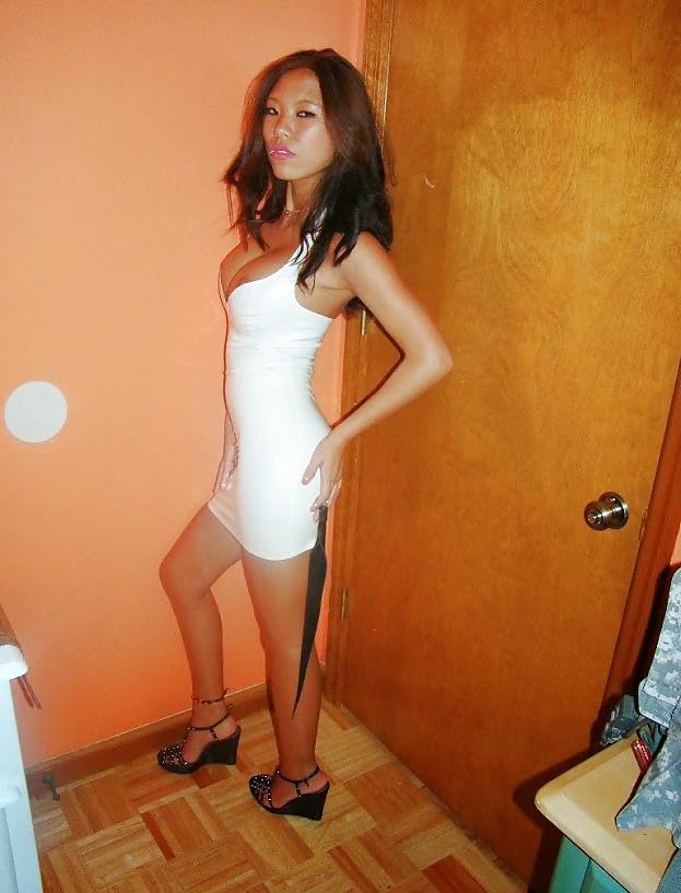 24P Asian spinner in tight dress