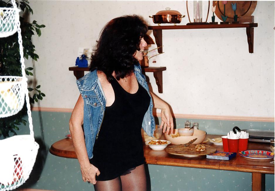 25P Lady T Bondage at a party in black dress.
