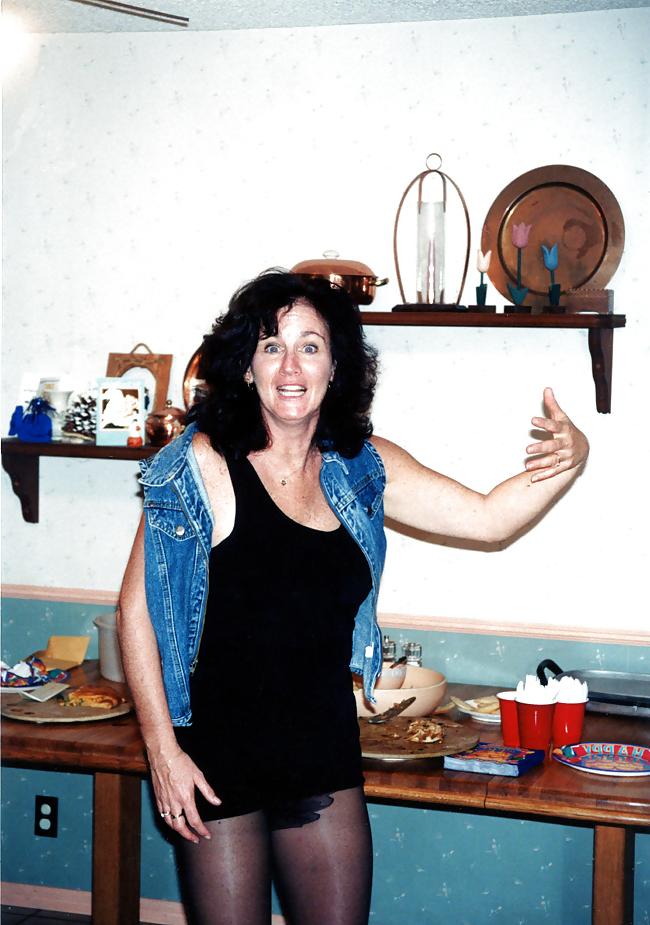 25P Lady T Bondage at a party in black dress.
