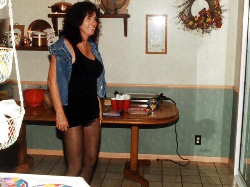 25P Lady T Bondage at a party in black dress.