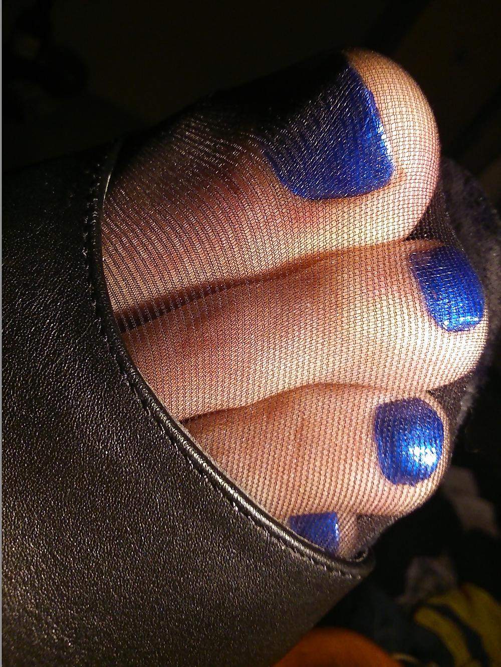 14P Feet In Black Stockings, Leather High Heels And Blue Polish