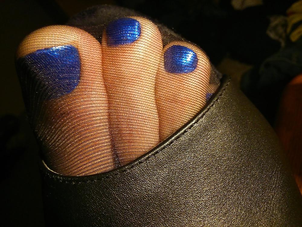 14P Feet In Black Stockings, Leather High Heels And Blue Polish