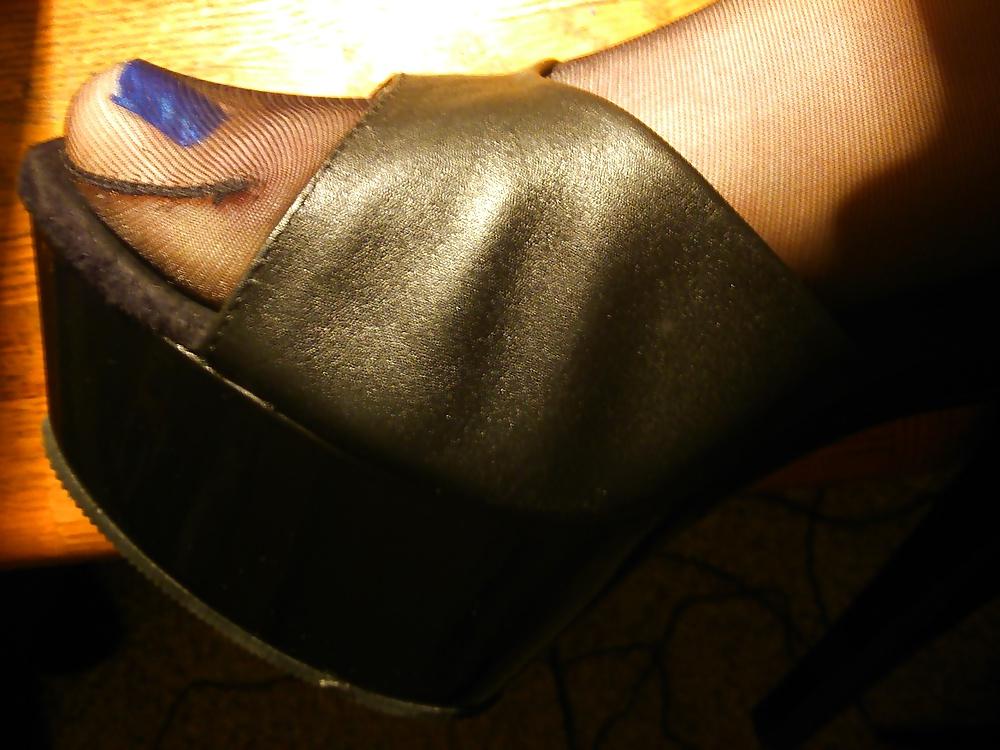 14P Feet In Black Stockings, Leather High Heels And Blue Polish