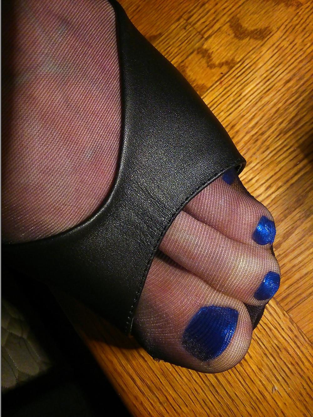 14P Feet In Black Stockings, Leather High Heels And Blue Polish
