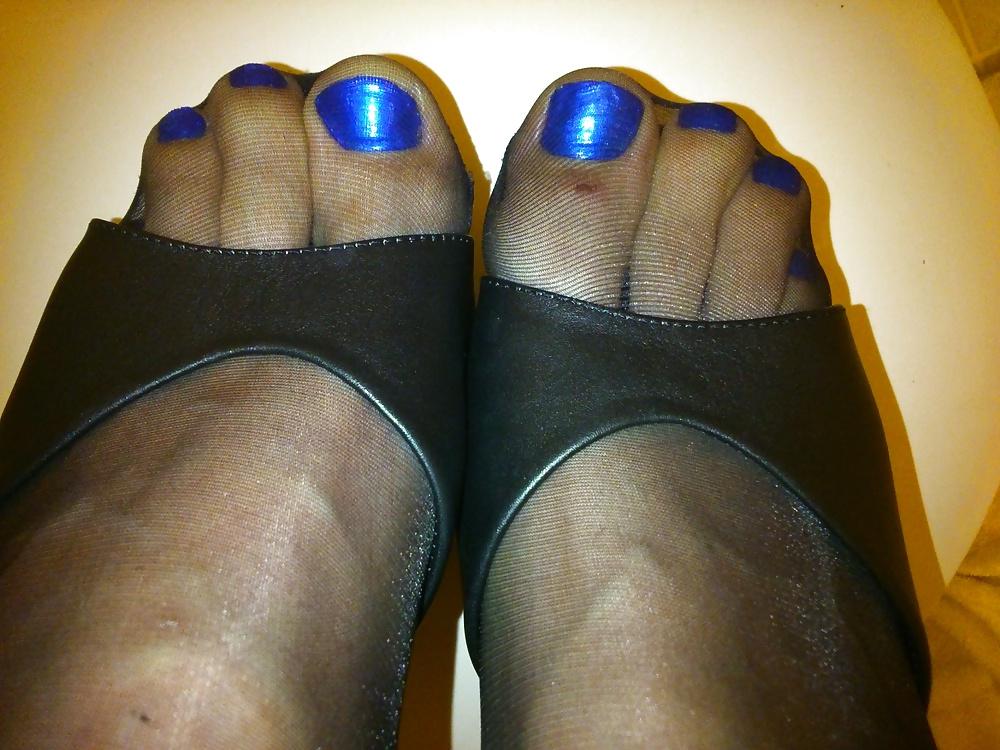14P Feet In Black Stockings, Leather High Heels And Blue Polish
