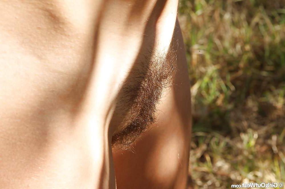 16P Cute hairy amateur girl spreads and fingers her beaver