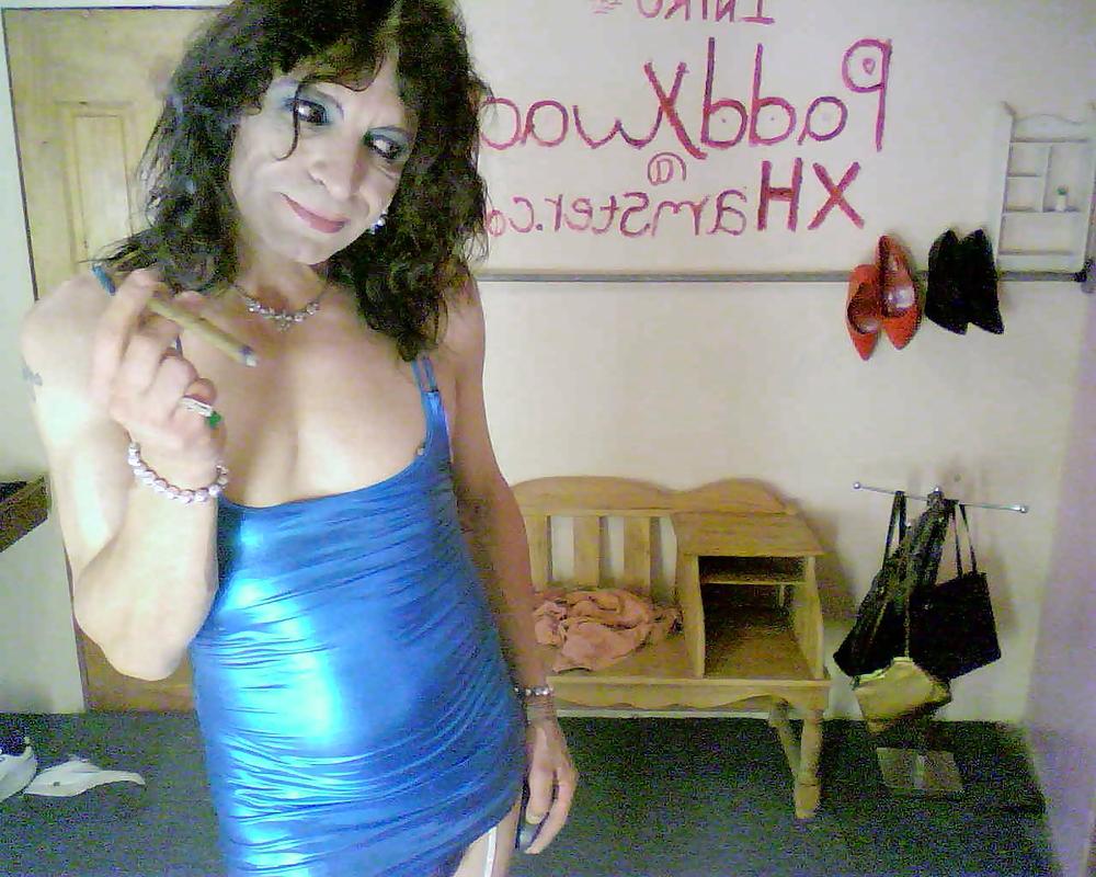 25P Metalic blue mini dress and a Cuban Cigar
