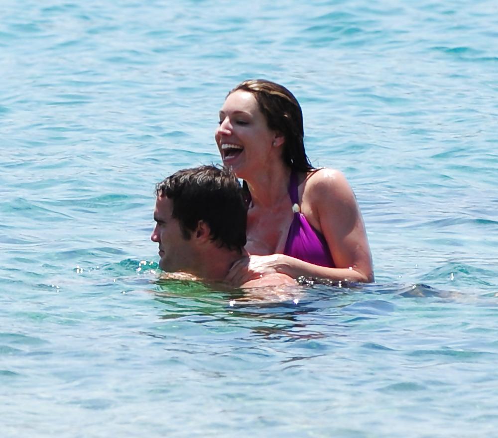 25P Kelly Brook in purple swimsuit on holiday