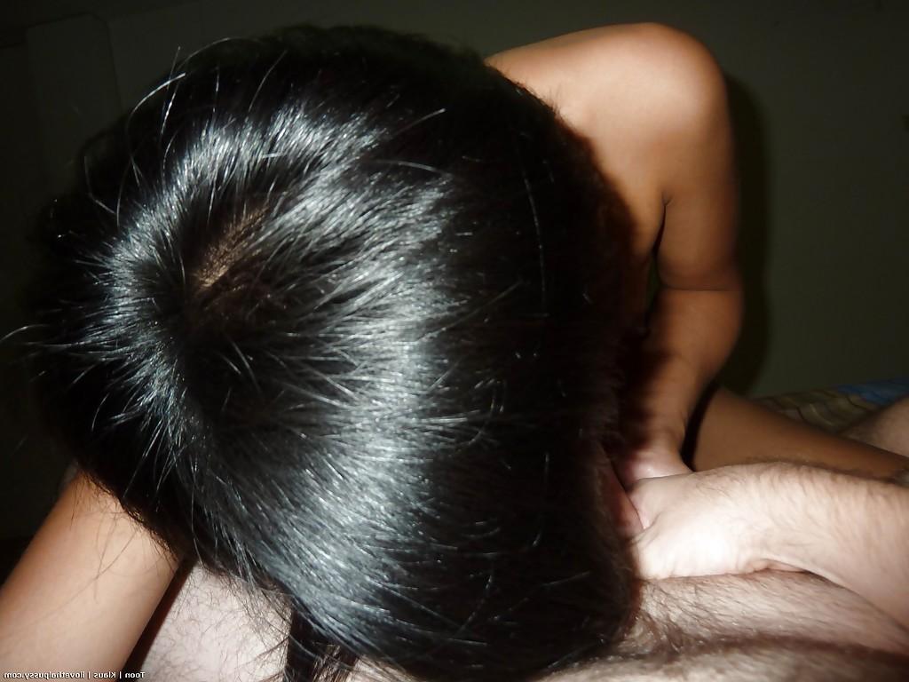 16P Asian babe with shaved twat giving a blowjob and licking guy's asshole