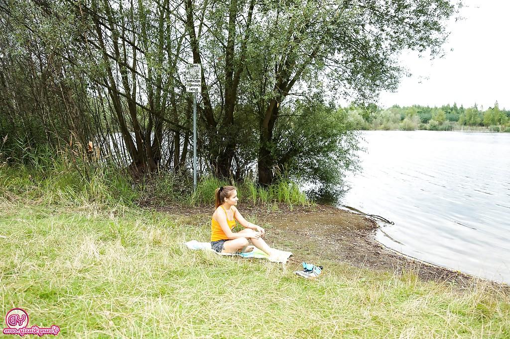 16P Busty teen amateur Adelle stripping naked in woods for swim in lake