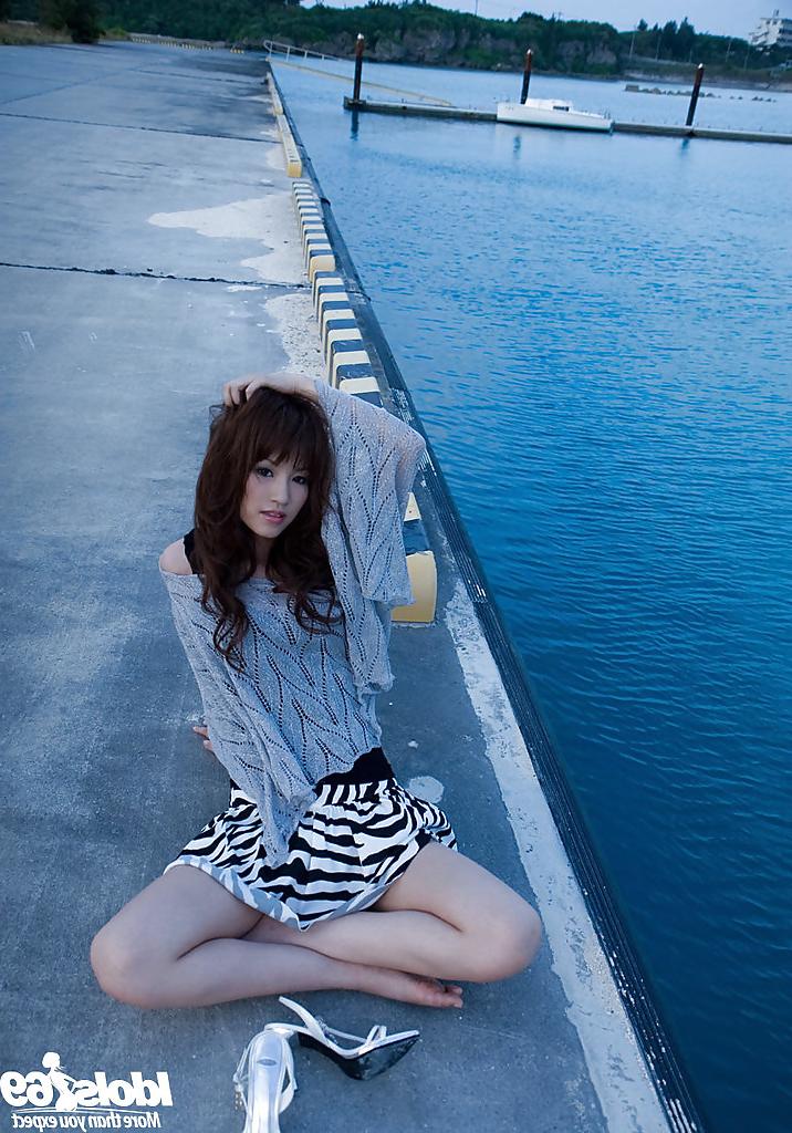 15P Tempting asian babe Mari Misaki stripping off her clothes outdoor