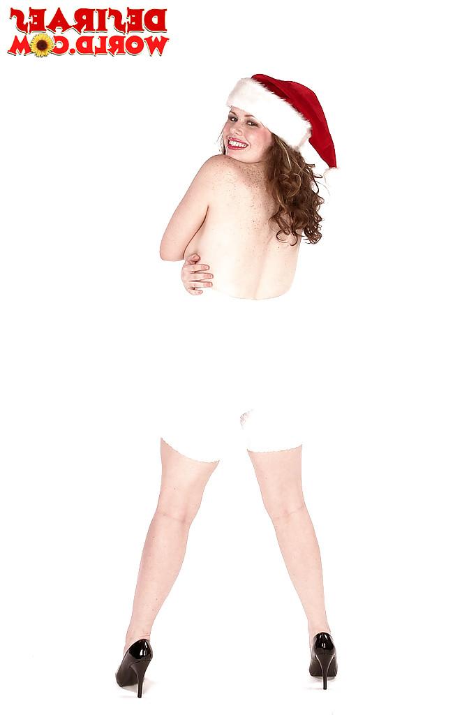 16P MILF pornstar Desirae flaunting massive tits in high heels at Christmas