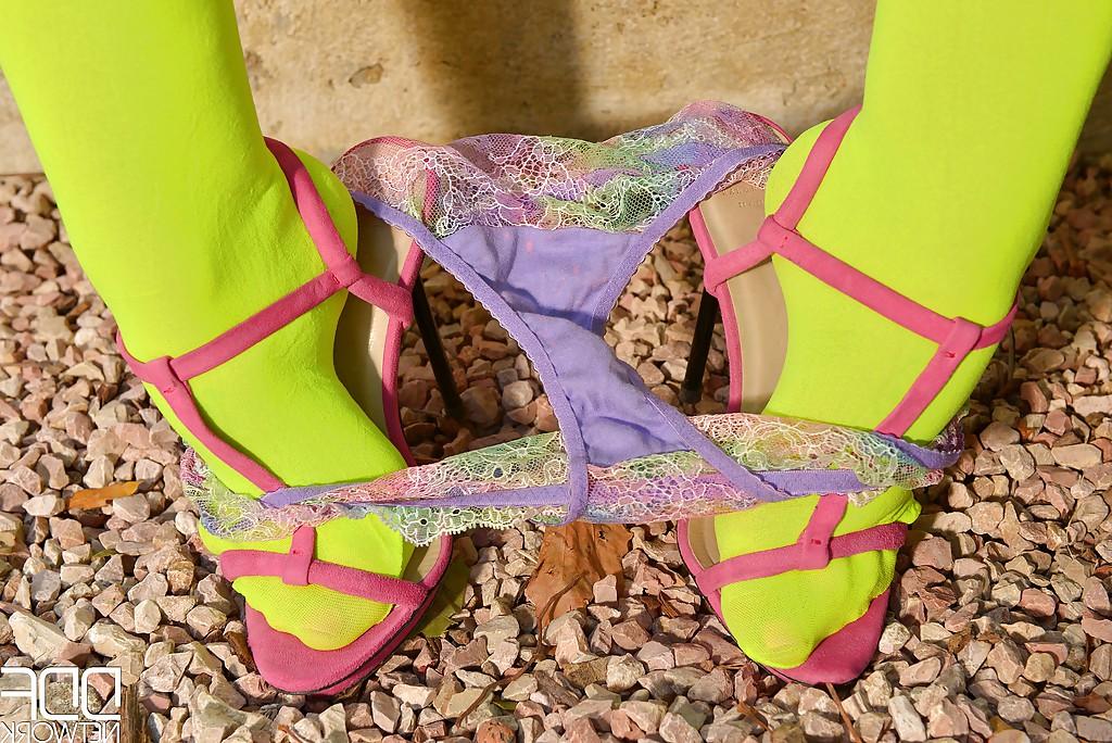 16P Cosplaying model LiLy Madison reveals her huge knockers in a garden