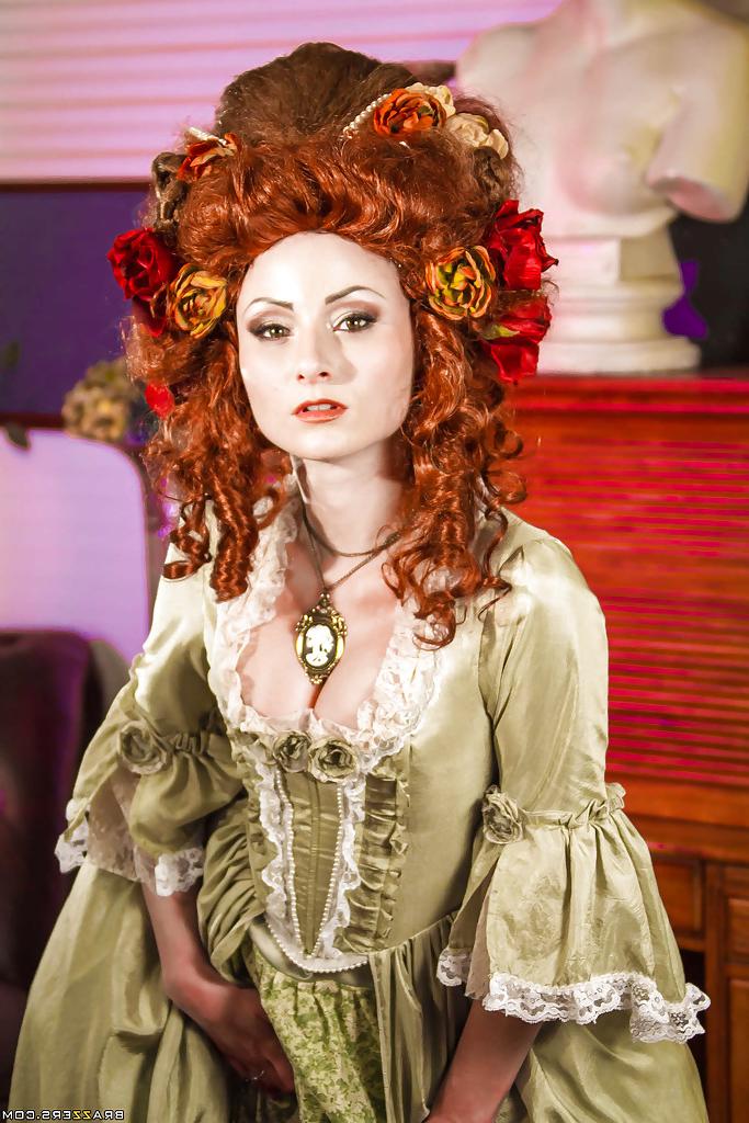 16P Glamorous redhead lady in white stockings uncovering her tattooed body