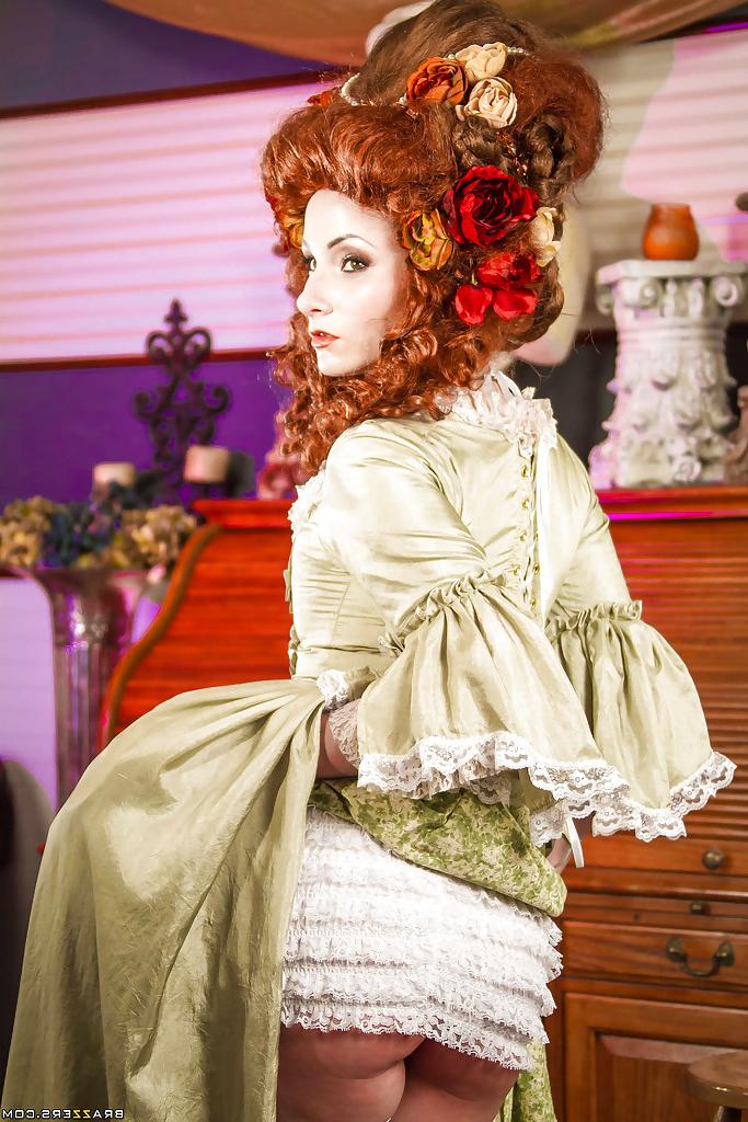 16P Glamorous redhead lady in white stockings uncovering her tattooed body