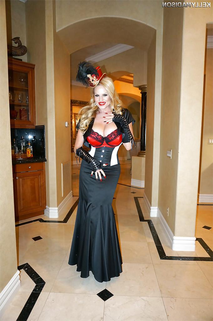 16P Older blonde MILF Kelly Madison modeling fully clothed in retro outfit