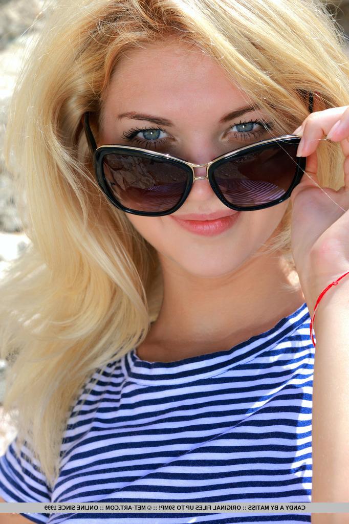 18P Young blonde Candy A shedding sunglasses and clothes in the forest