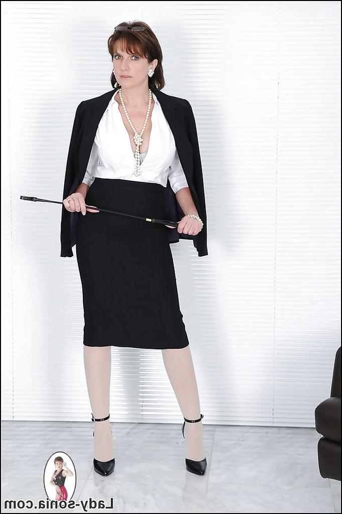 15P Lusty mature lady in formal suit and pantyhose revealing her big tits