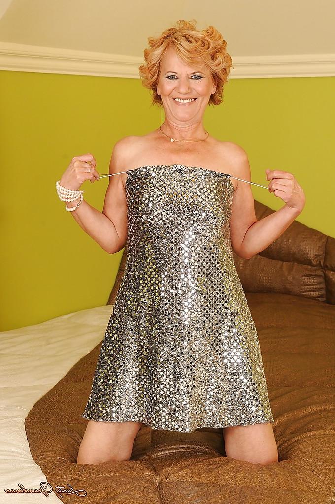 16P Naughty granny on high heels stripping off her dress and spreading her legs