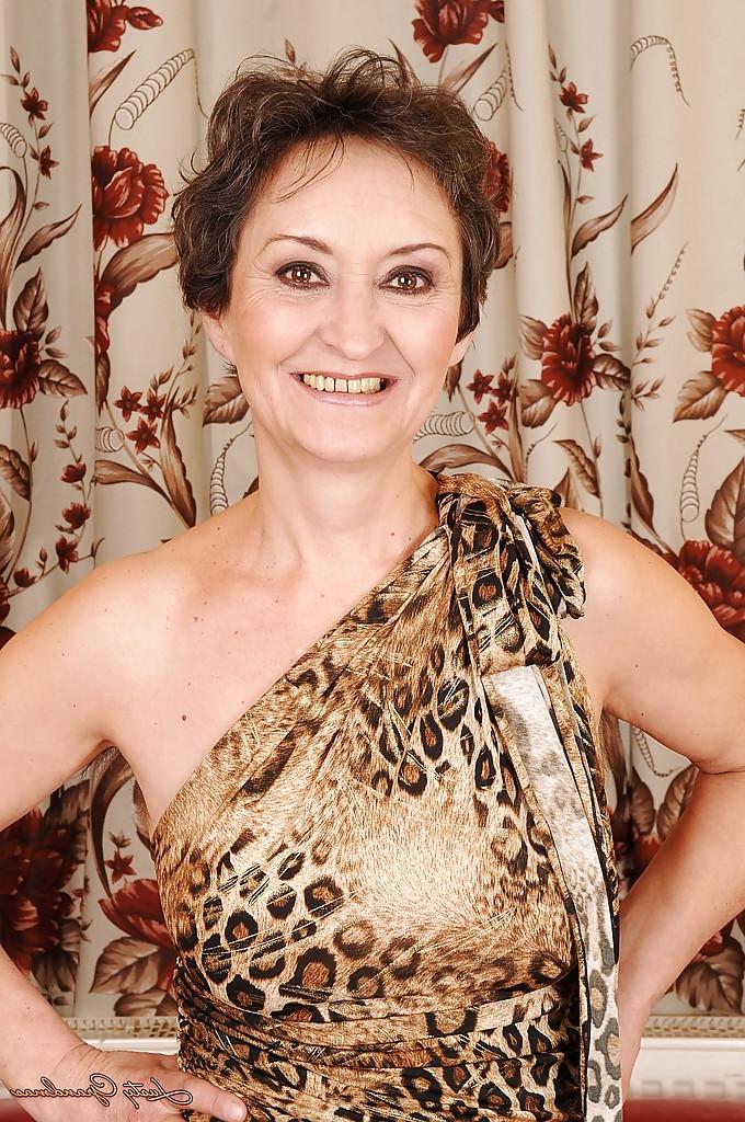 16P Lustful granny taking off her dress and exposing her hairy twat