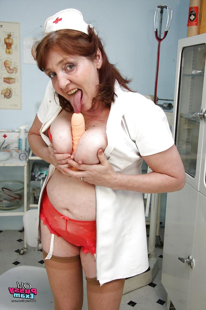16P Redhead granny licking her flabby tits and playing with a big toy