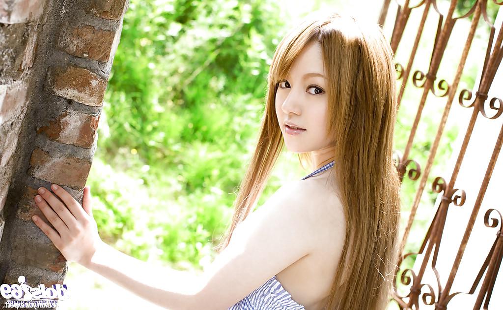 15P Stunning asian babe Ria Sakurai uncovering her graceful body outdoor