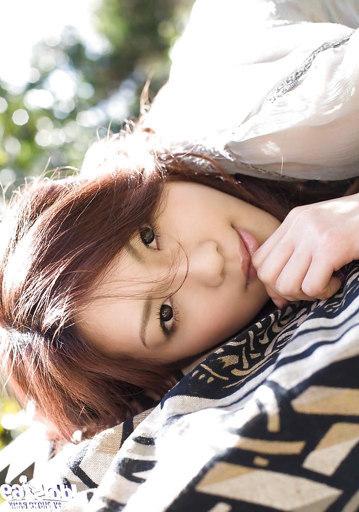 14P Seductive asian vixen on high heels Ryo Shinohara posing outdoor