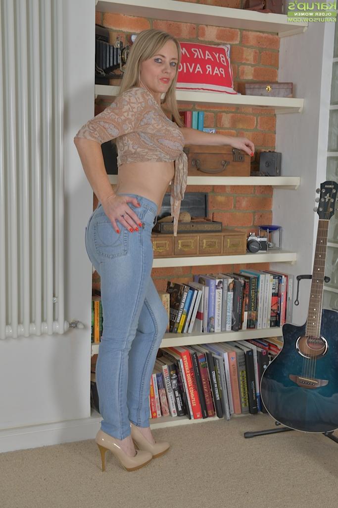 16P Blonde Euro woman Sofi Rae modelling topless in faded blue jeans