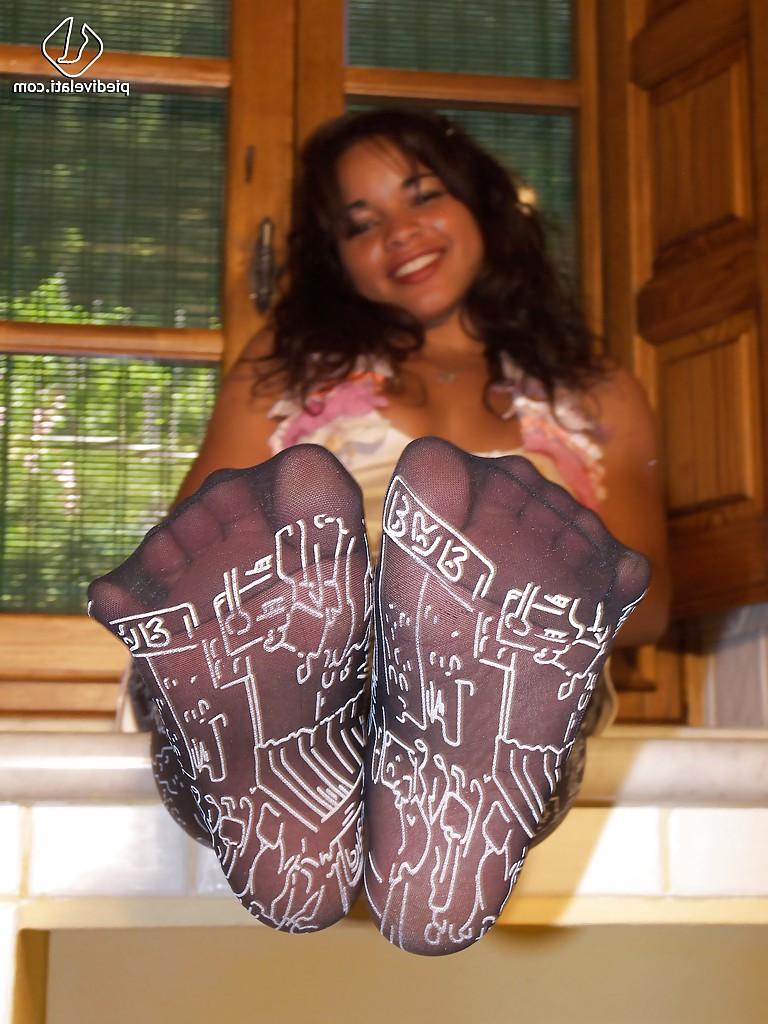 16P Cute and sexy Latina girl Dafne demonstrating her funny looking pantyhose