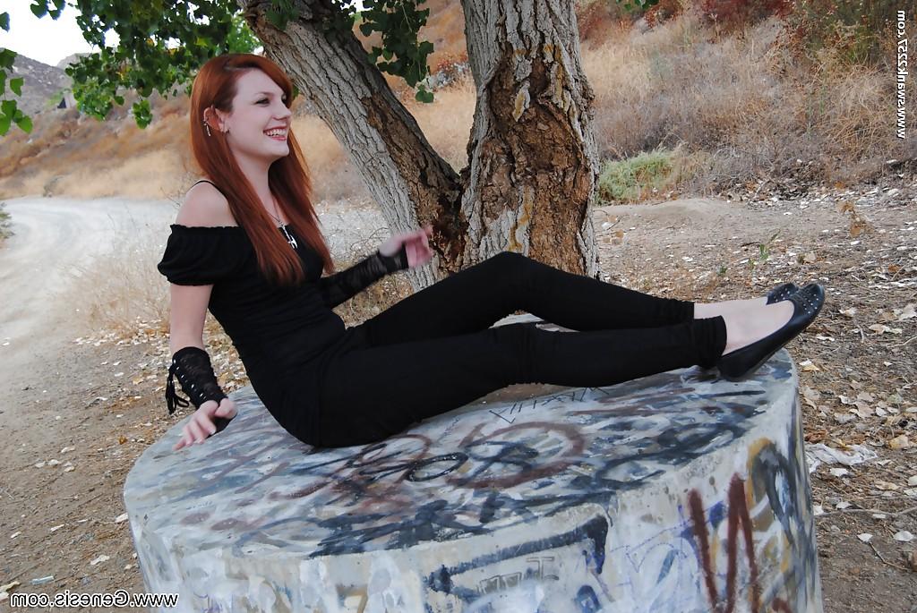 16P Redhead punk chick Nicci Vice showing off natural tits in forest