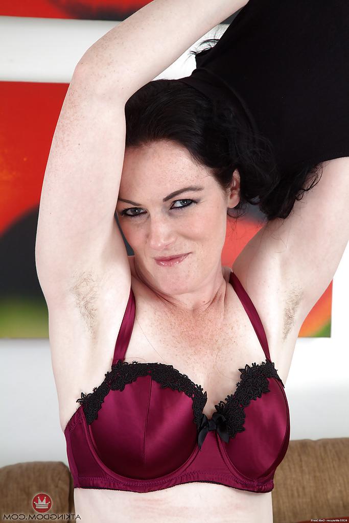 16P Dark haired MILF Andrea Foster releasing hairy cunt from miniskirt and panties