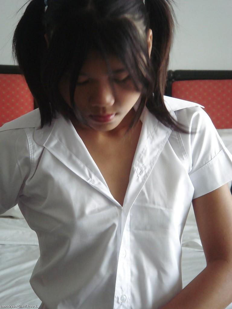 16P Asian cutie in mini skirt and stockings stripping and playing with a dildo