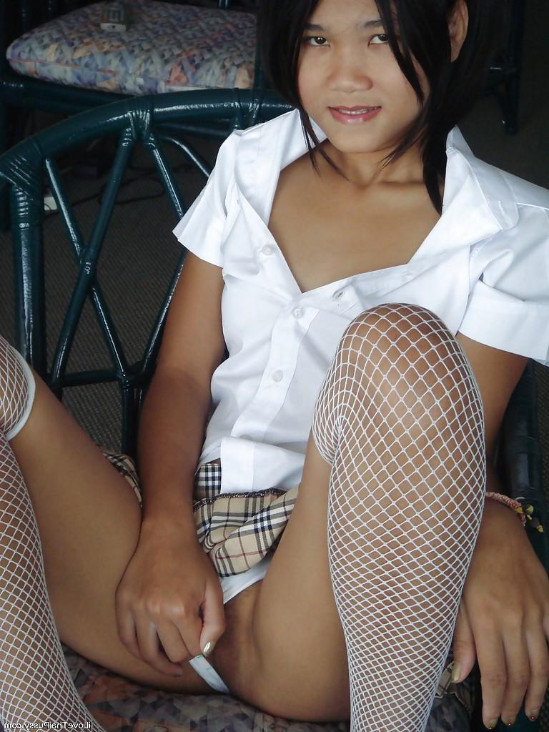 16P Asian cutie in mini skirt and stockings stripping and playing with a dildo