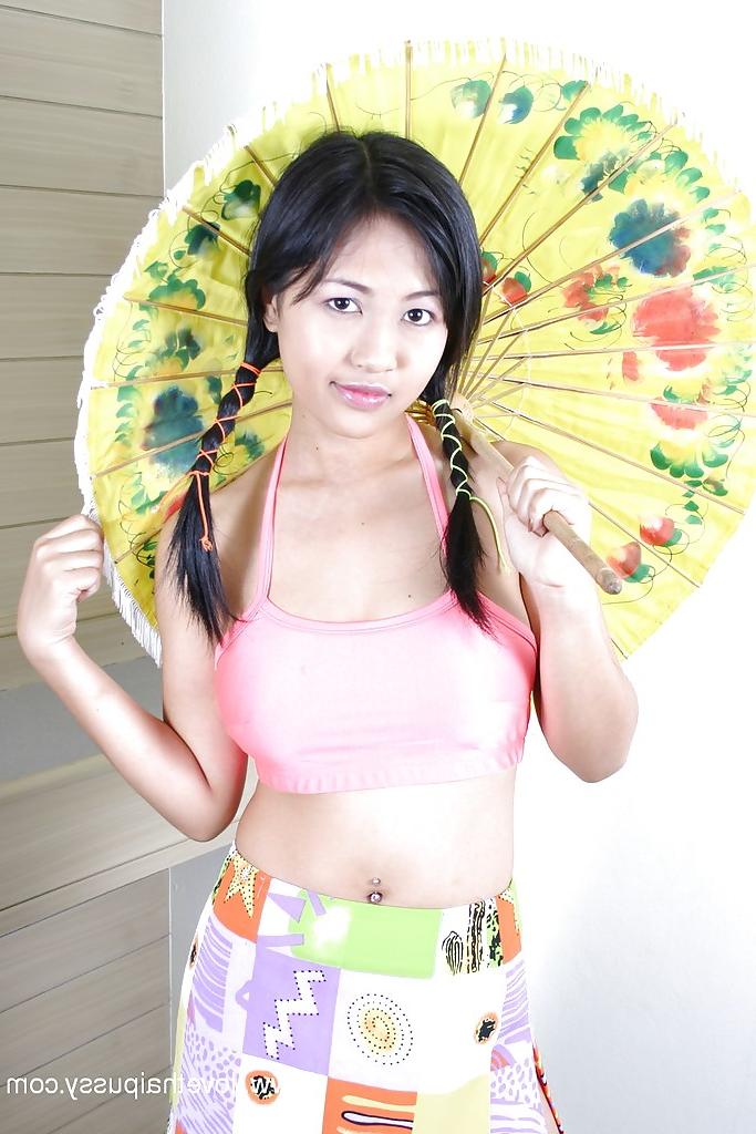 16P Busty asian babe with pigtails stripping and playing with a dildo