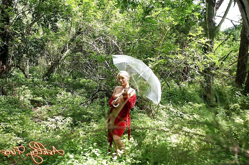 12P Hot blonde chick Ashley Fires posing for sexy topless photos in the forest