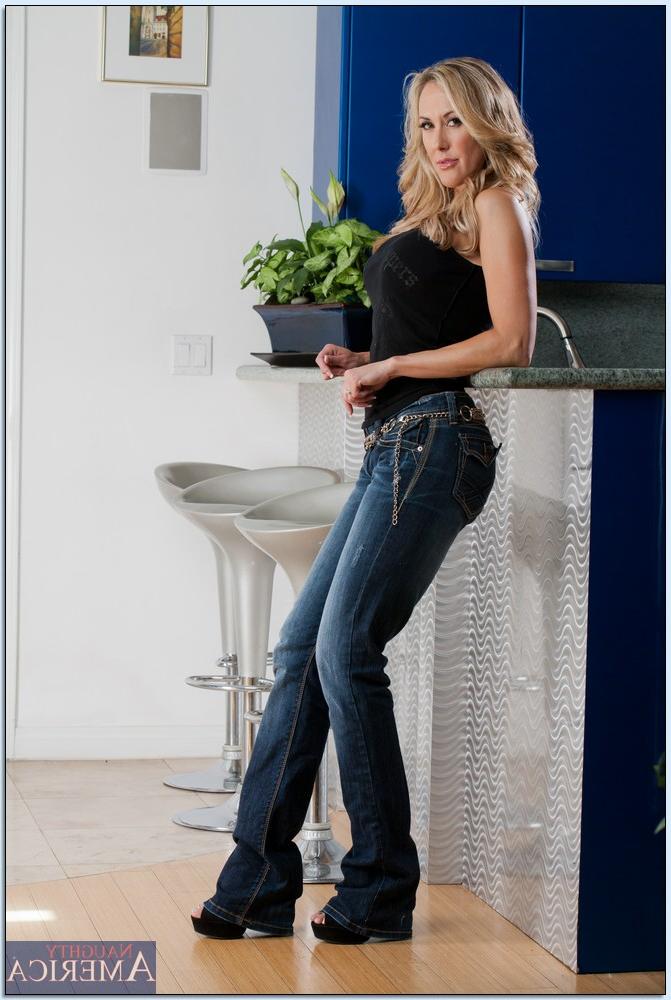16P Busty MILF Brandi Love takes off her jeans and panties to pose naked
