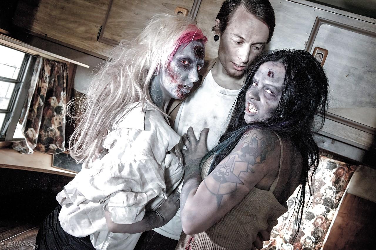 14P Fetish models Brittany Lynn and Jessie Lee giving head in Zombie threesome