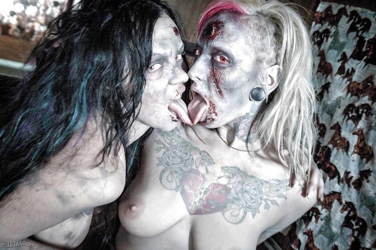 14P Fetish models Brittany Lynn and Jessie Lee giving head in Zombie threesome