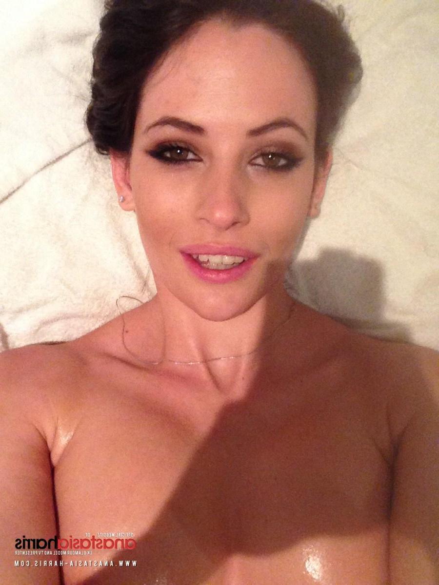 12P Anastasia Harris rubs some oil on her sexy boobies
