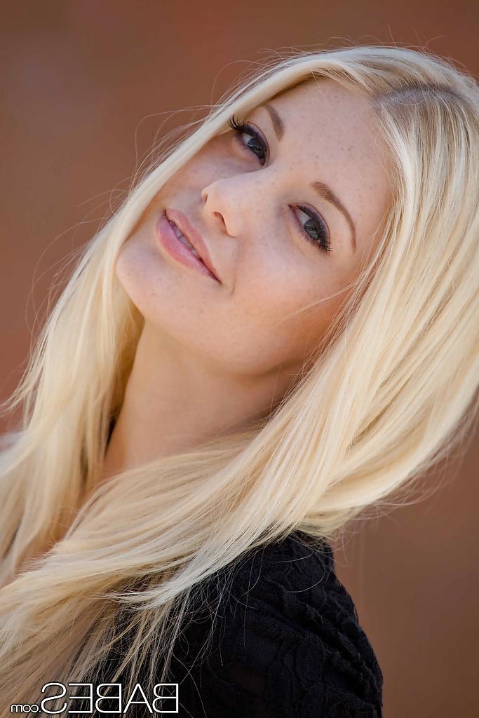 16P Amazingly lovely blonde in black nylons exposing her slim curves outdoor