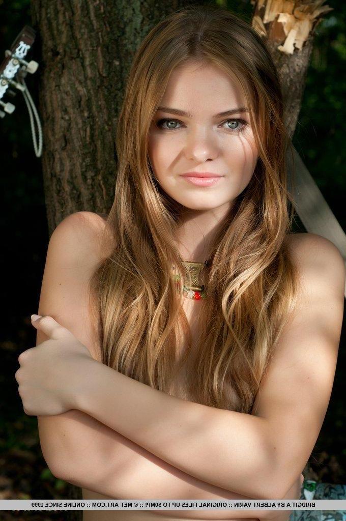 18P Pictures of redhead teen Bridgit A naked and spreading in the woods