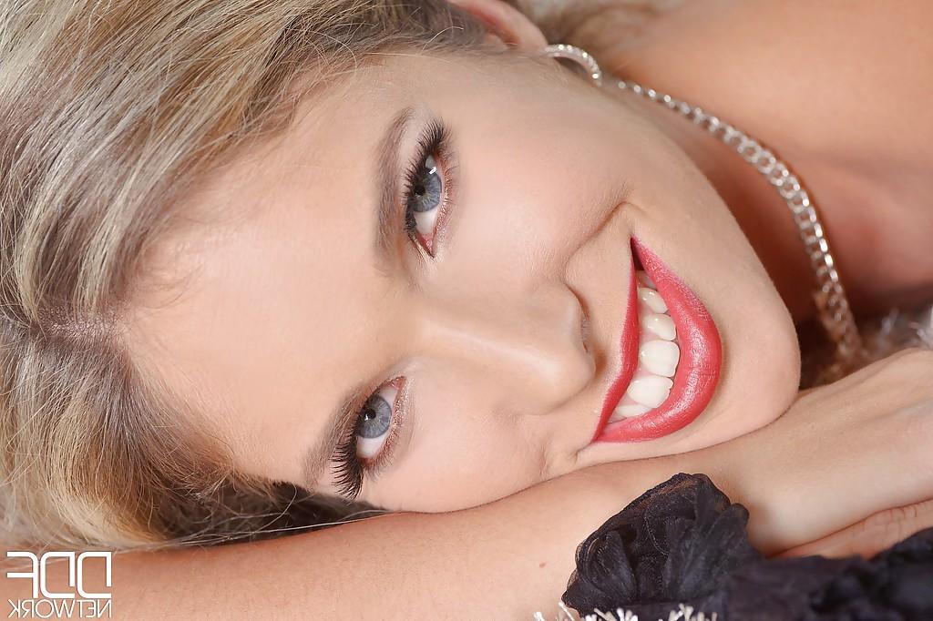 16P Gorgeous blonde babe Eva Parcker removing stiletto heels stocking clad feet