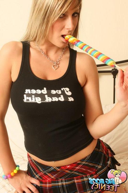 16P Pictures of busty schoolgirl Demi sucking her lollipop in bed