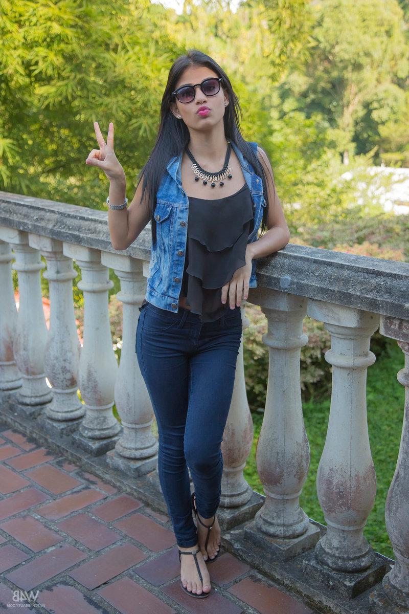 16P Pretty latina Denisse Gomez strips nude for you outside